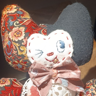2023 handsewn imp doll made of scrap fabric, ribbon, and lace. a christmas gift for my wife.